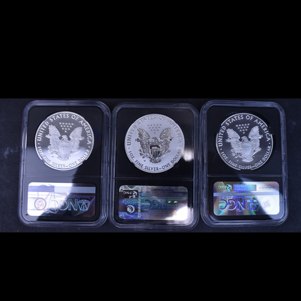 Three $1 Silver Eagle Slabbed 1 Oz. Coins