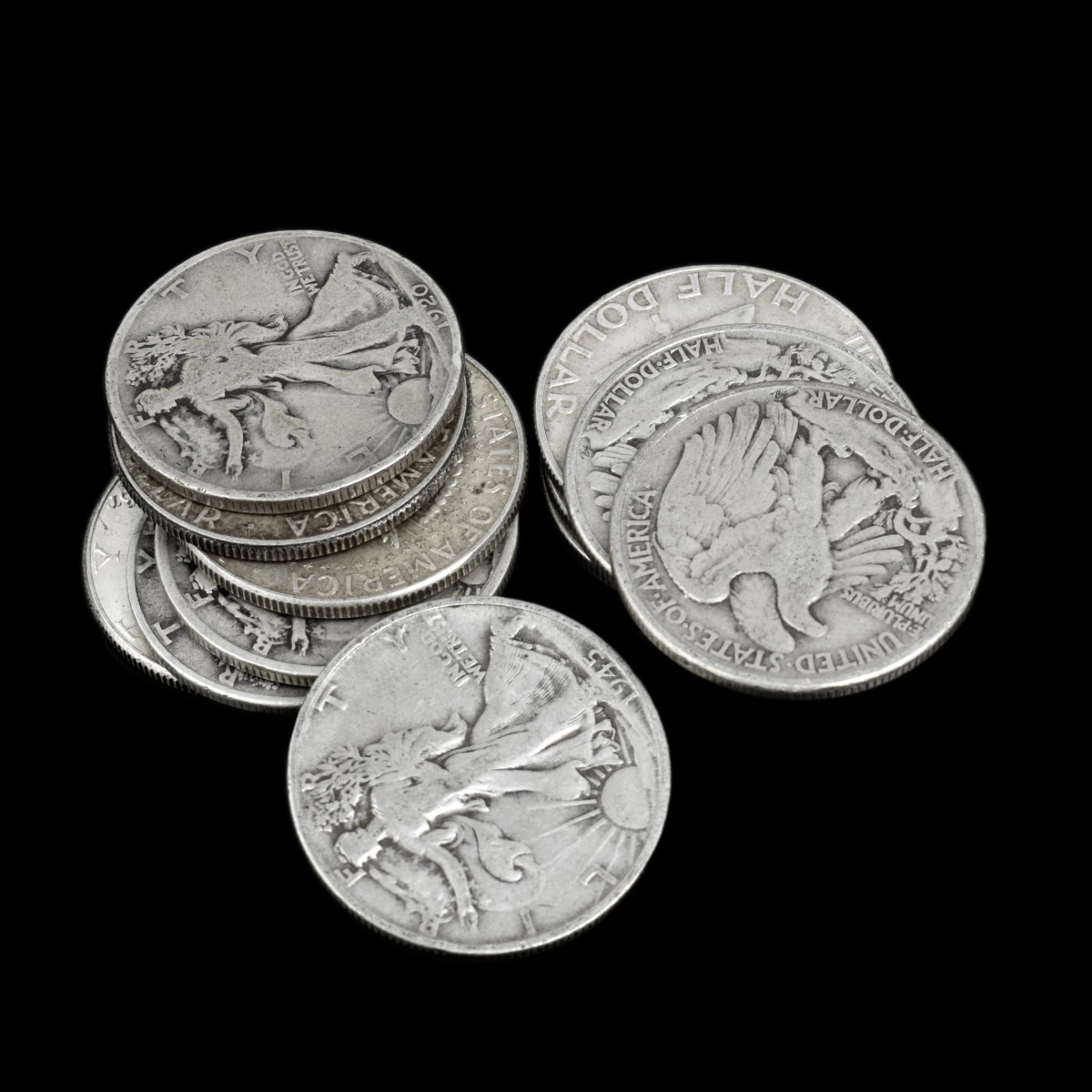 Thirteen U.S. Silver Half Dollars