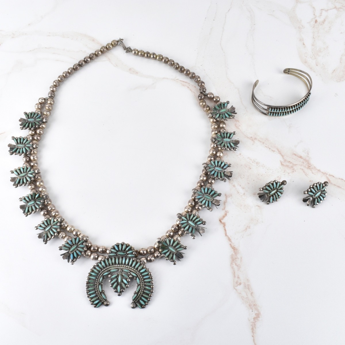 Silver and Turquoise Squash Blossom Jewelry