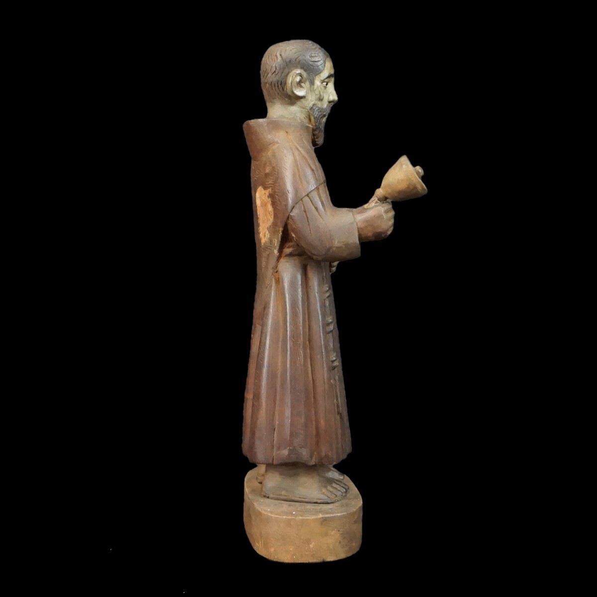 Hand Carved Santos Figurine ringing Bell