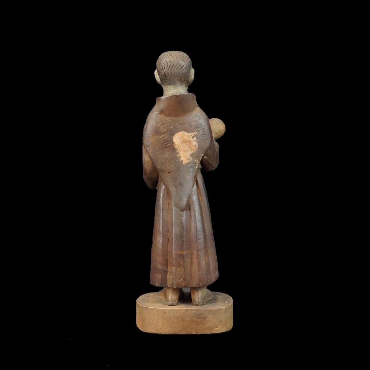 Hand Carved Santos Figurine ringing Bell