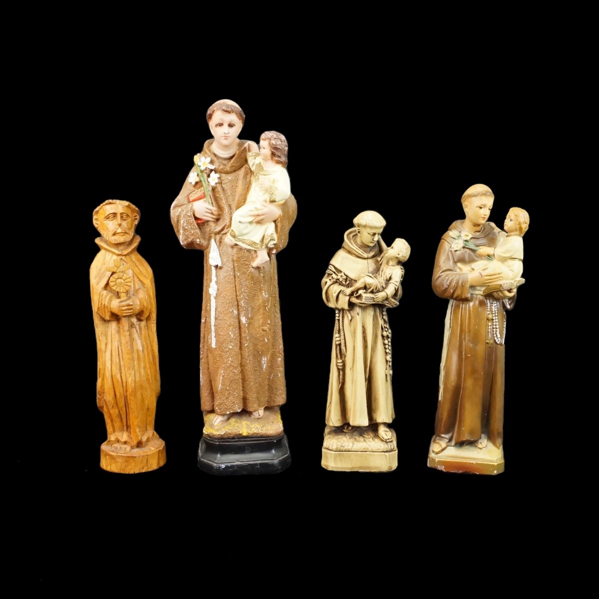 Four Santos Figurines