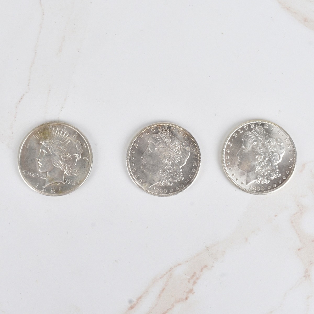 Three US Silver Dollar Coins