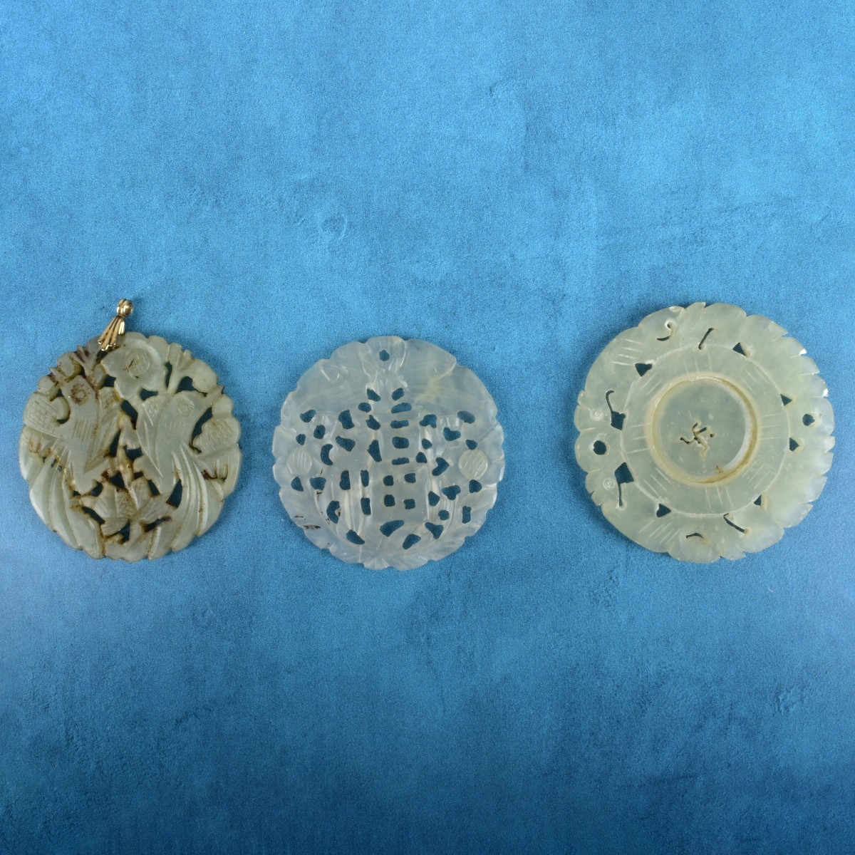 Three Chinese Jade Disk Pendants