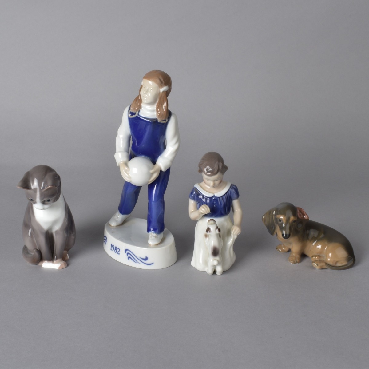 Four Porcelain Figurines