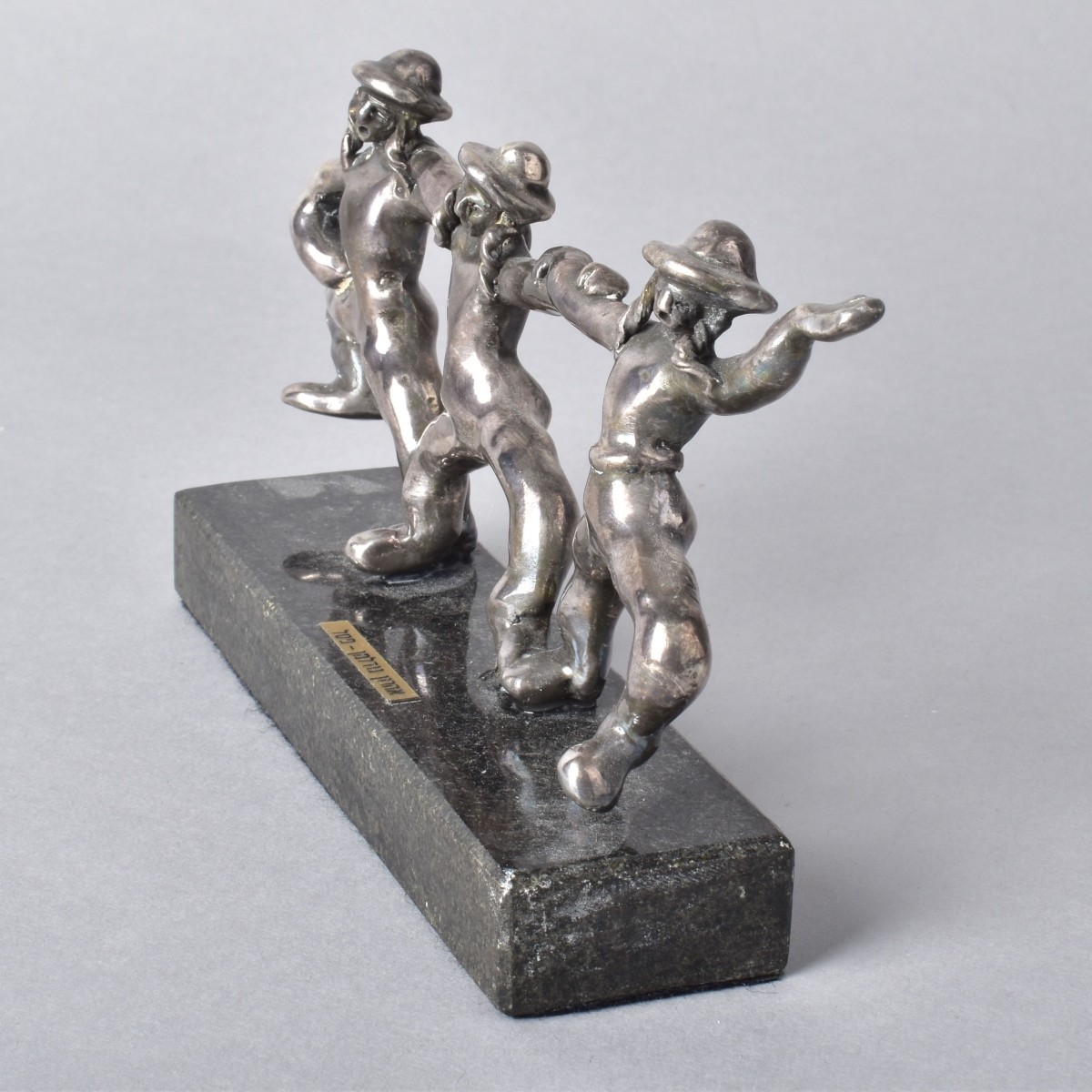 Three Silver-Clad Sculptures