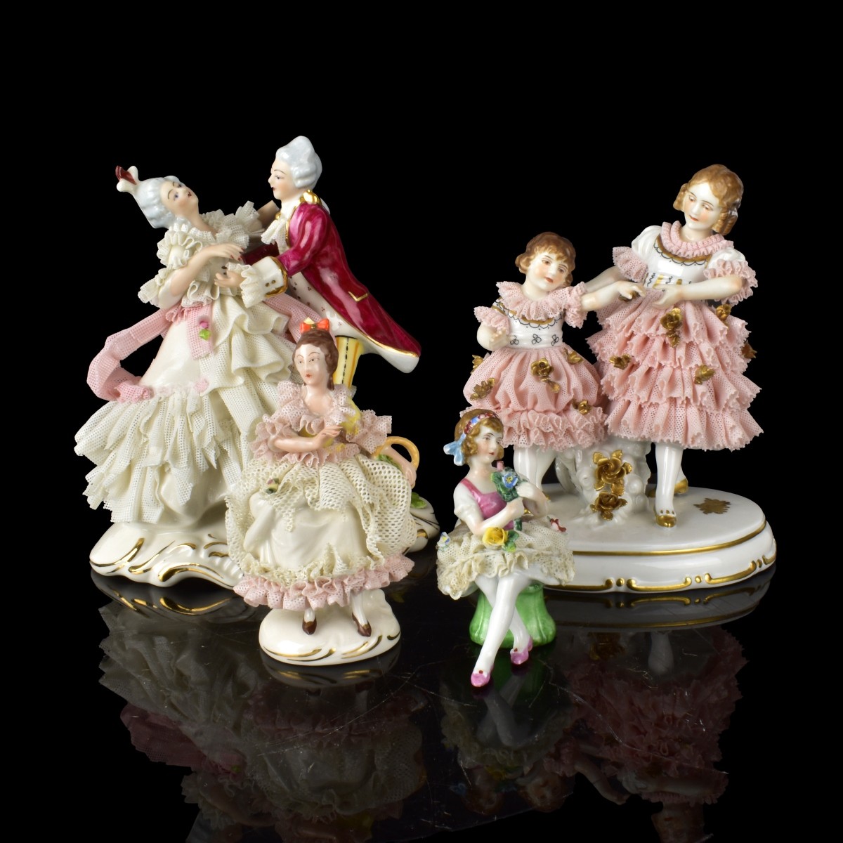 Four Dresden Lace Porcelain Figurines