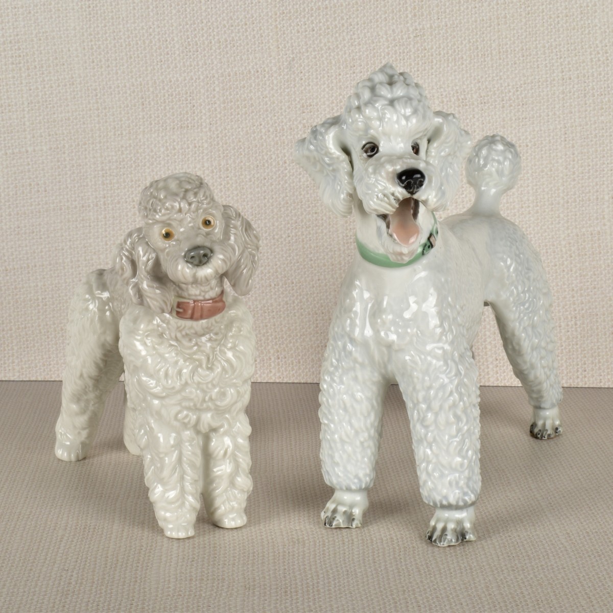 Two Porcelain Poodle Figurines