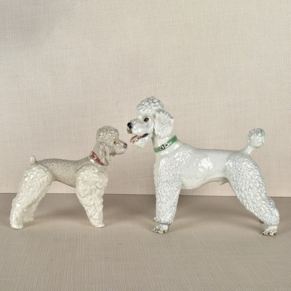 Two Porcelain Poodle Figurines