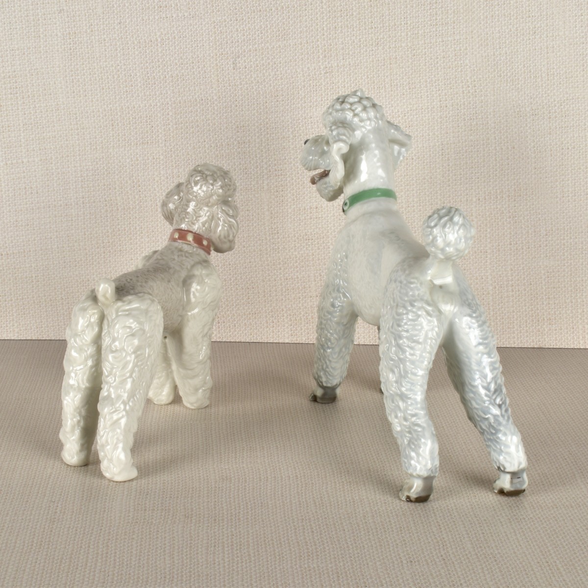 Two Porcelain Poodle Figurines
