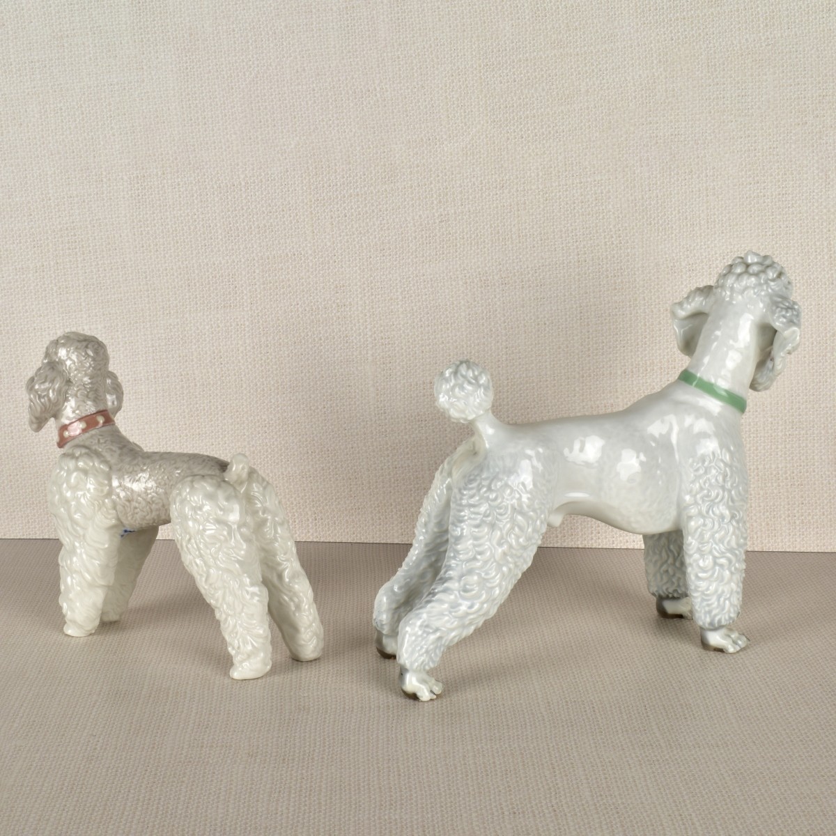 Two Porcelain Poodle Figurines