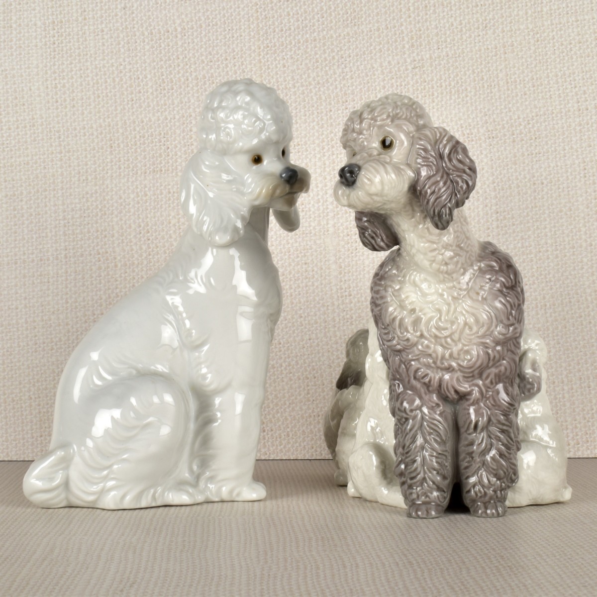 Two Lladro Porcelain Poodle Figurines