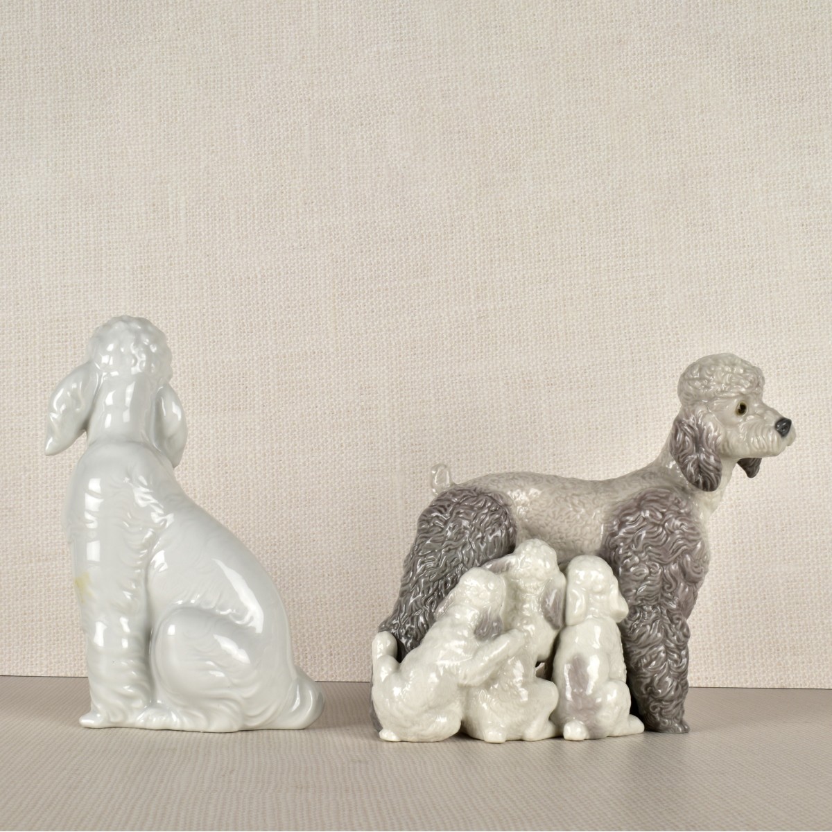 Two Lladro Porcelain Poodle Figurines