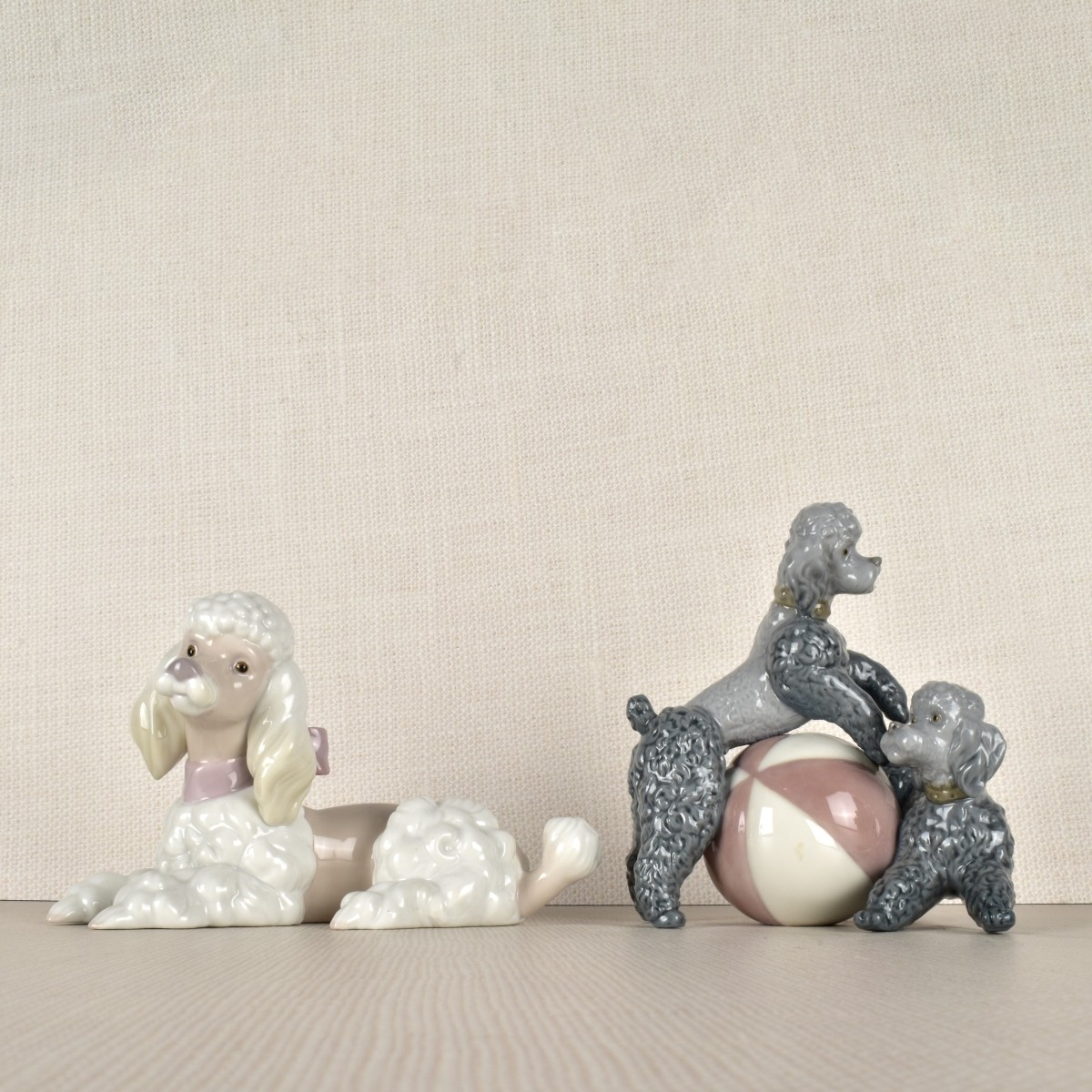 Two Lladro Porcelain Poodle Figurines
