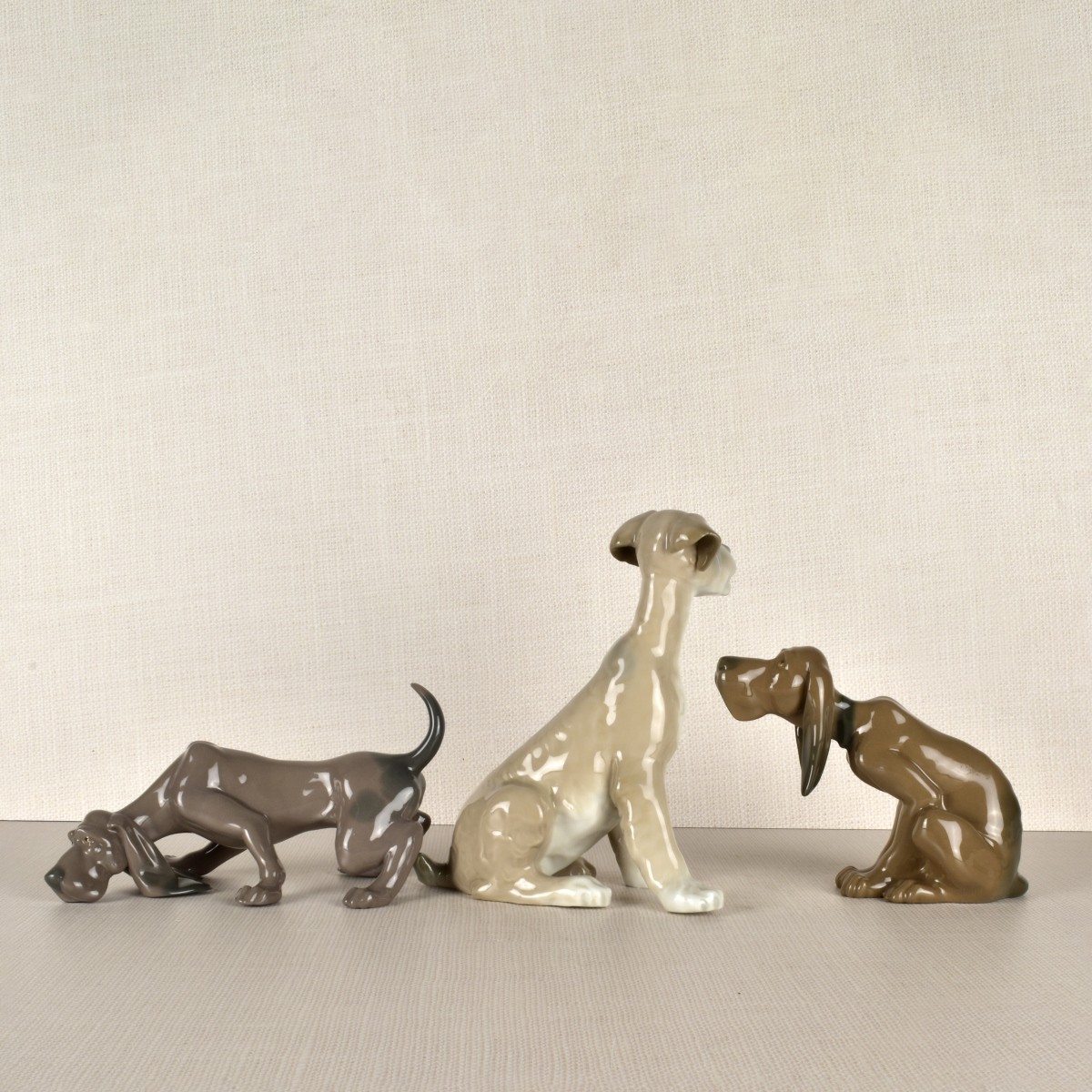 Three Lladro Porcelain Dog Figurines