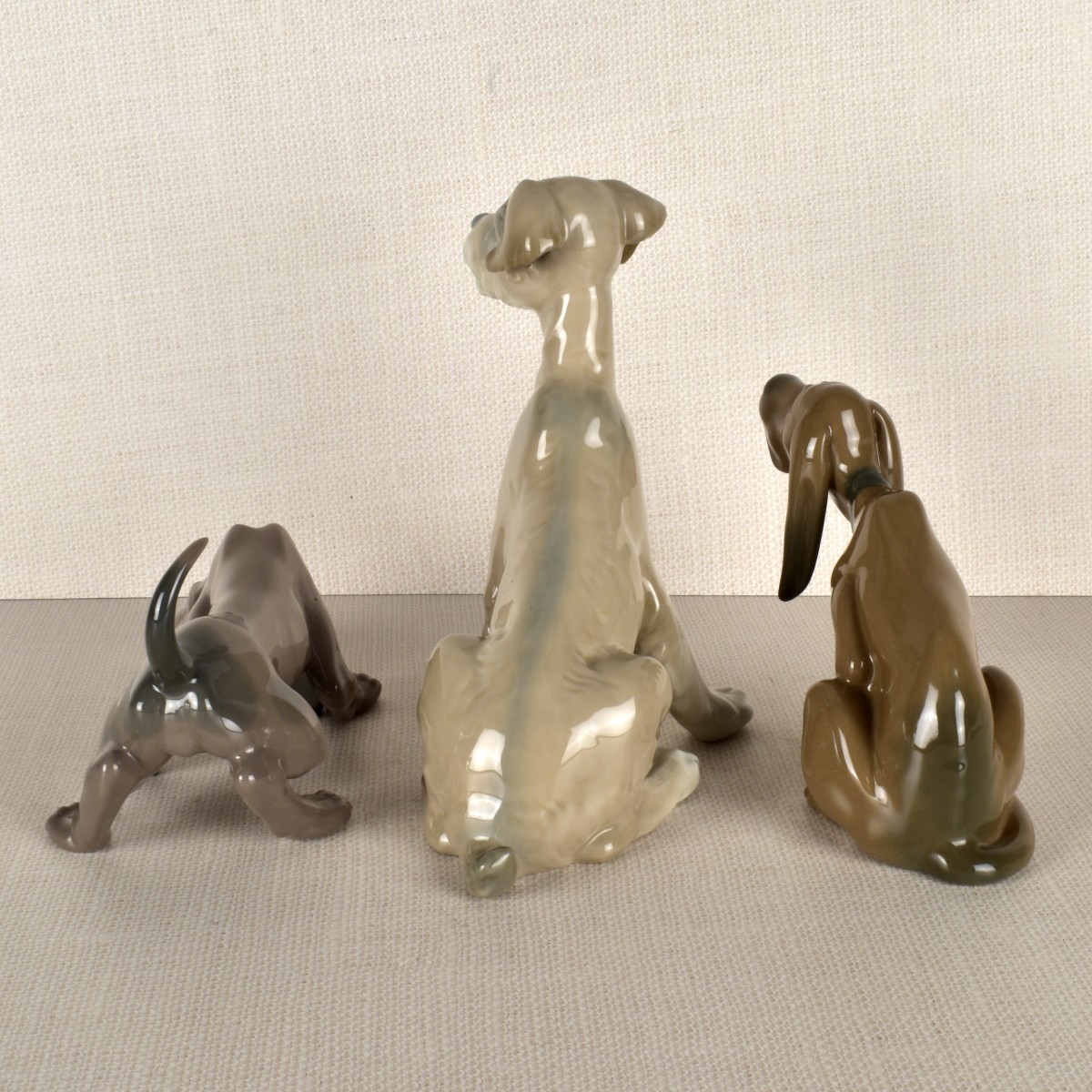 Three Lladro Porcelain Dog Figurines