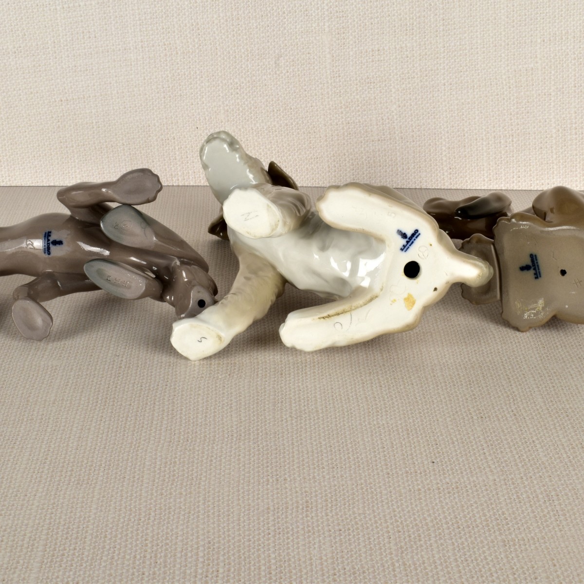 Three Lladro Porcelain Dog Figurines