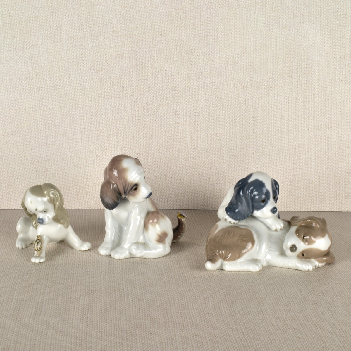 Three Lladro Porcelain Puppy Figurines