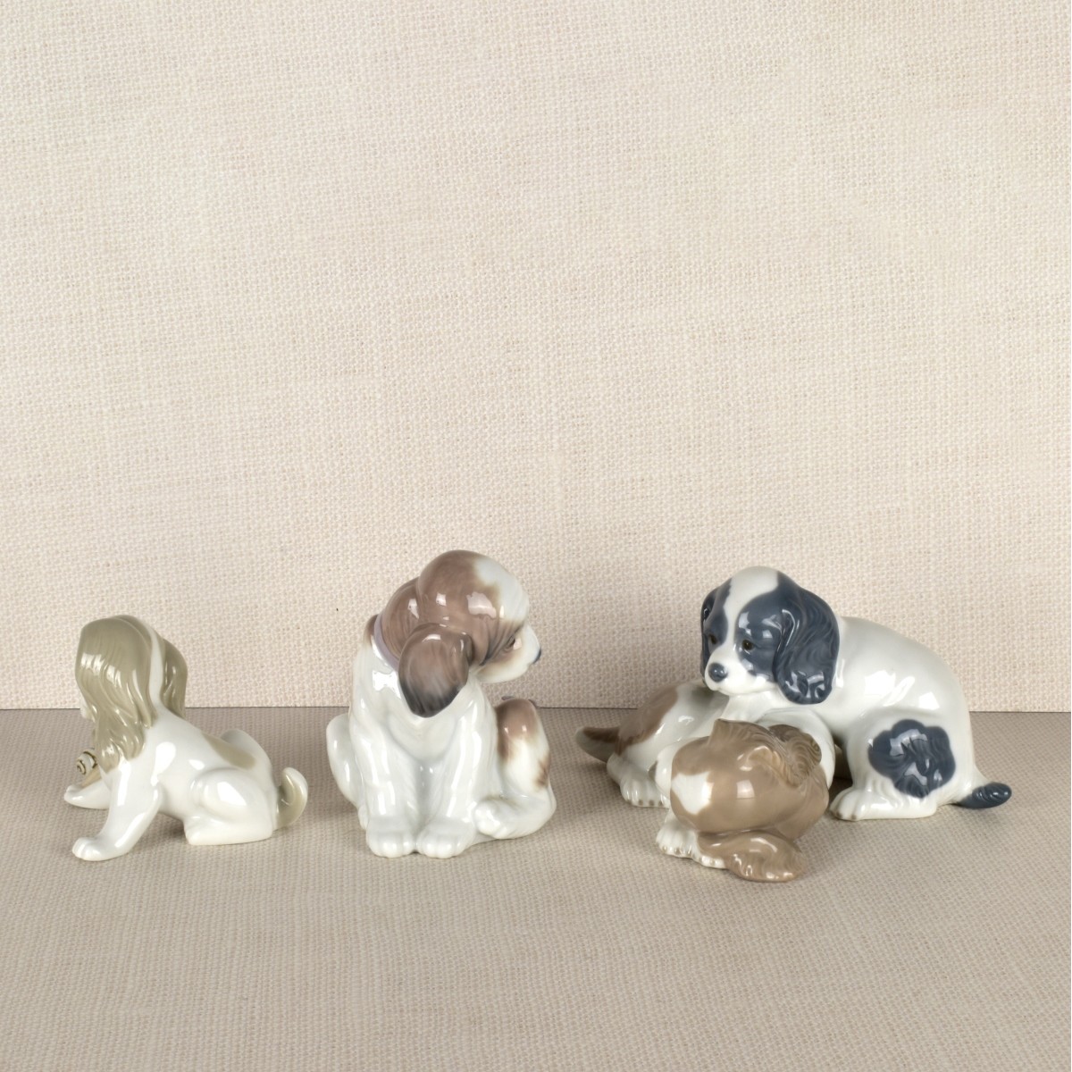 Three Lladro Porcelain Puppy Figurines