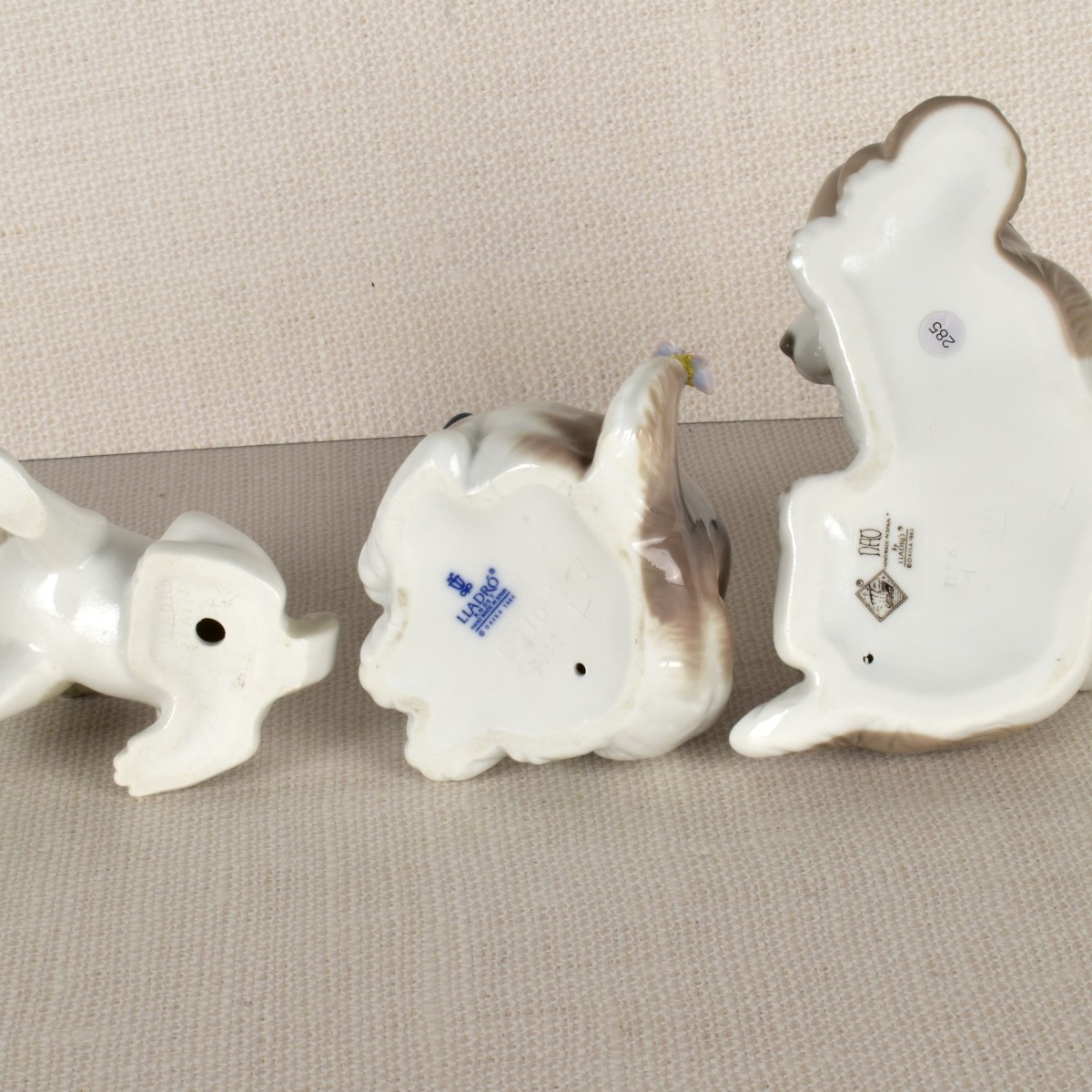 Three Lladro Porcelain Puppy Figurines