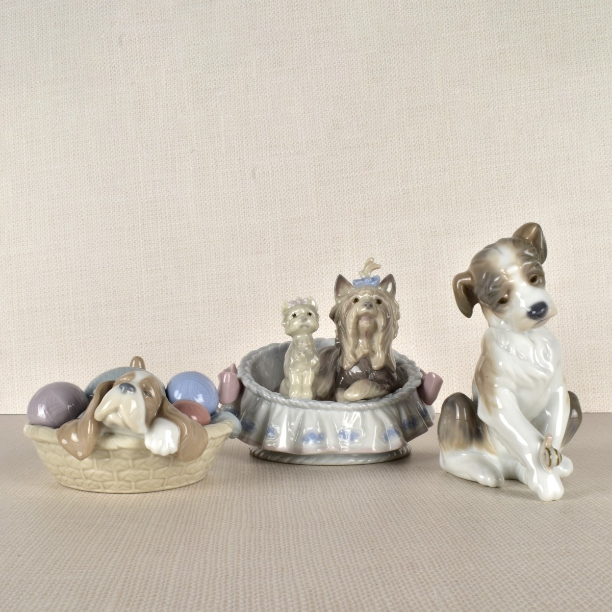 Three Lladro Porcelain Dog Figurines
