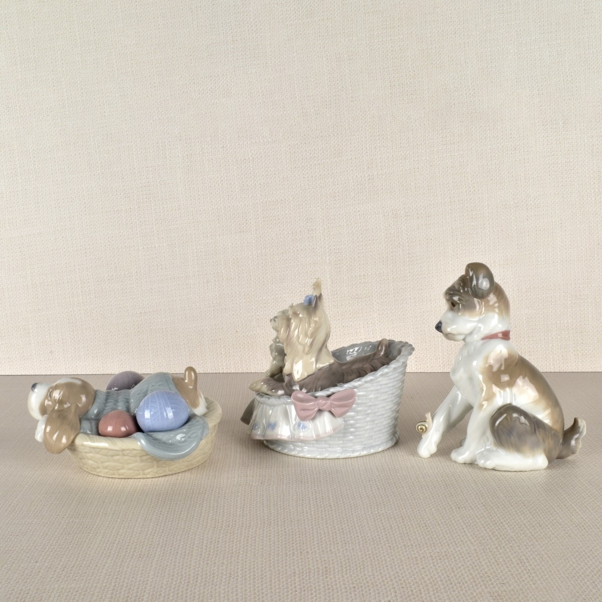Three Lladro Porcelain Dog Figurines