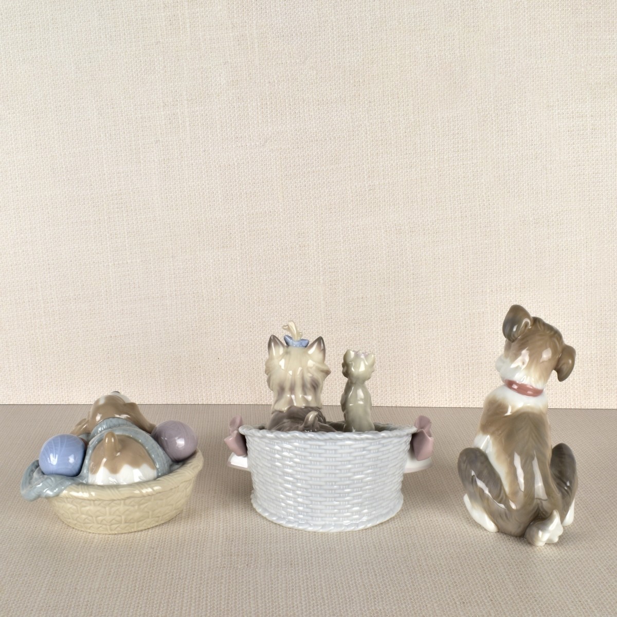 Three Lladro Porcelain Dog Figurines