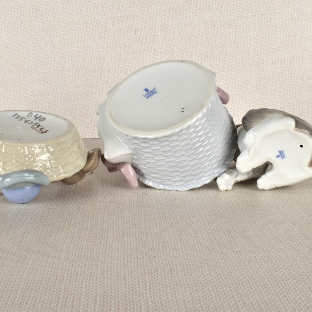Three Lladro Porcelain Dog Figurines