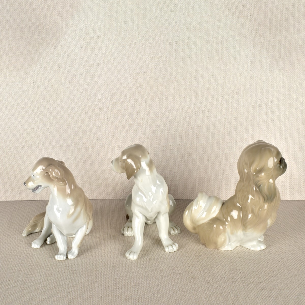 Three Lladro Porcelain Dog Figurines