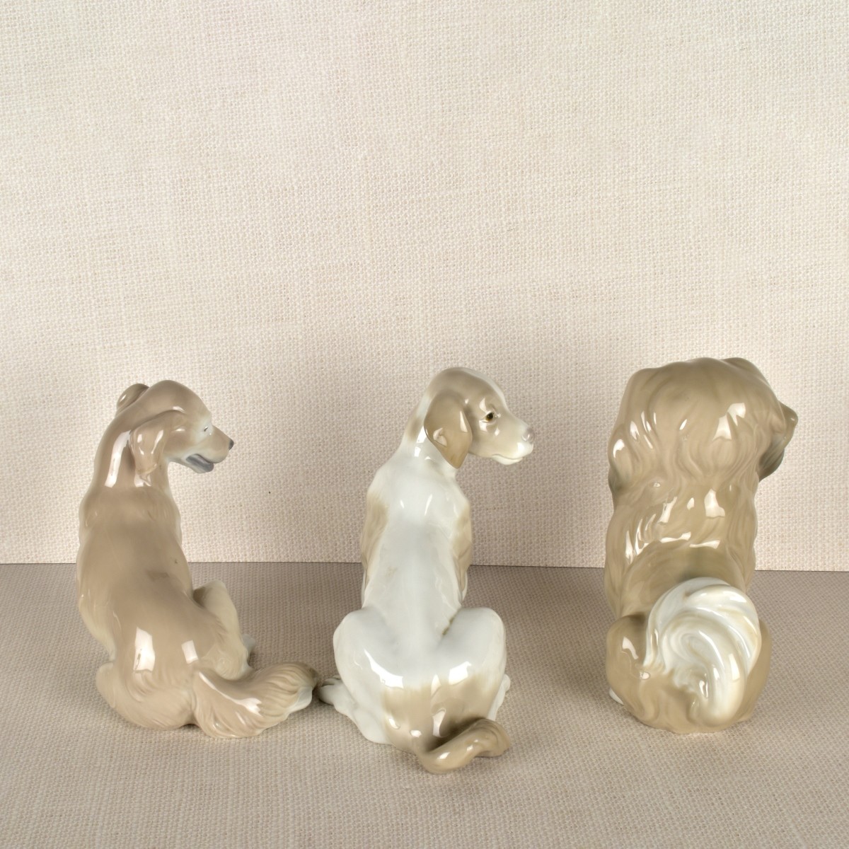 Three Lladro Porcelain Dog Figurines