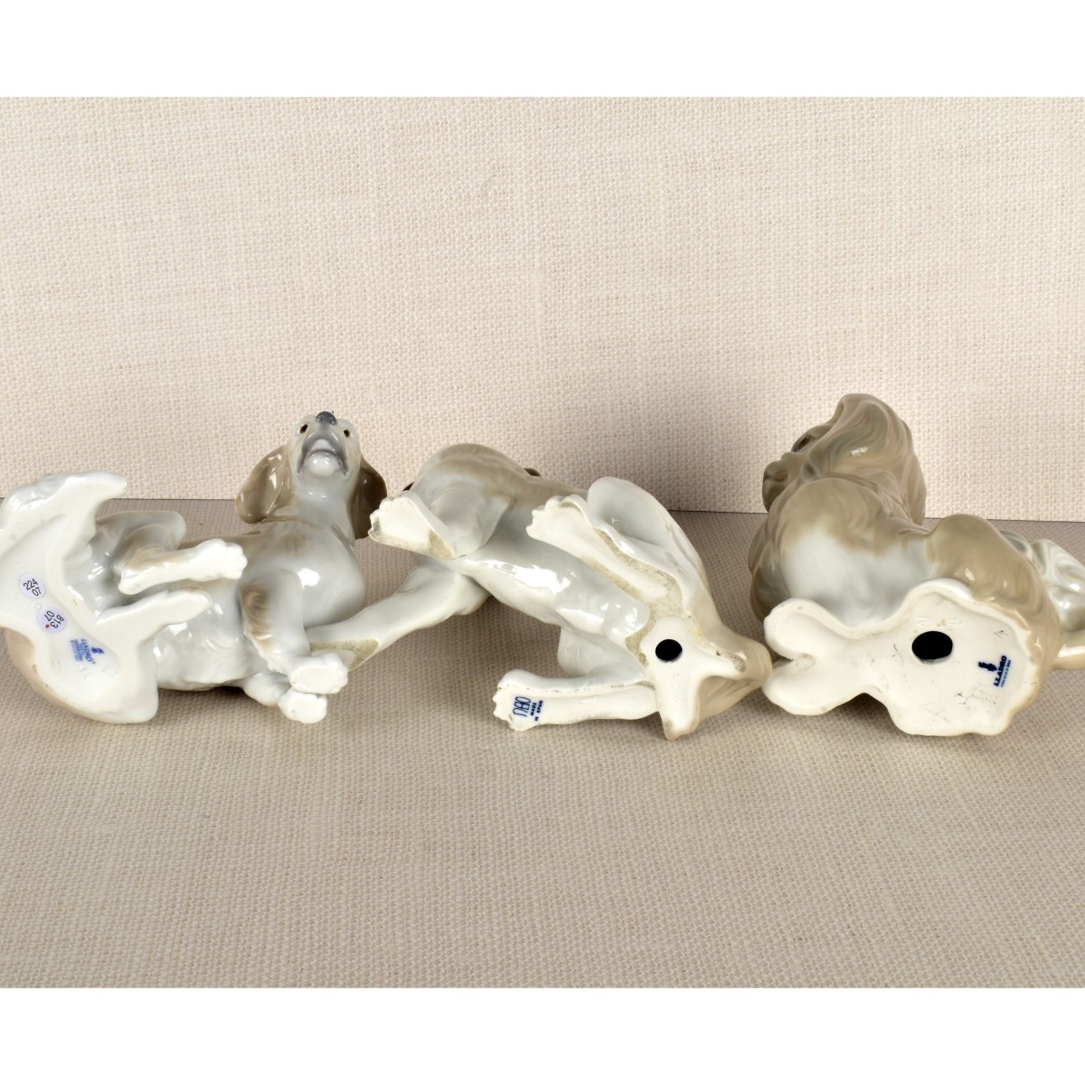 Three Lladro Porcelain Dog Figurines