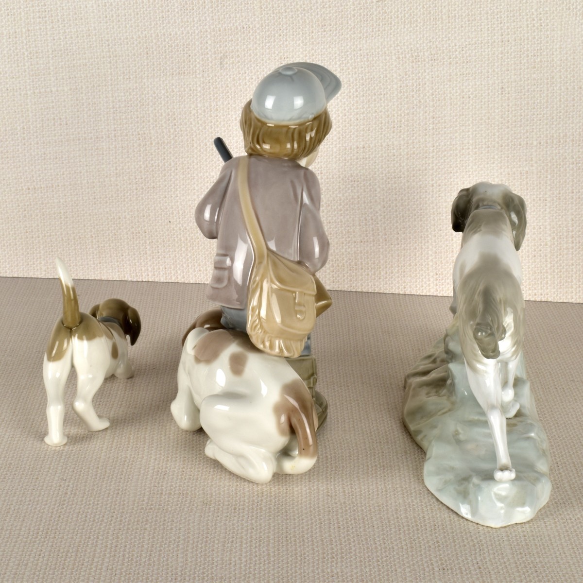 Three lladro Porcelain Hunt Dog Figurines