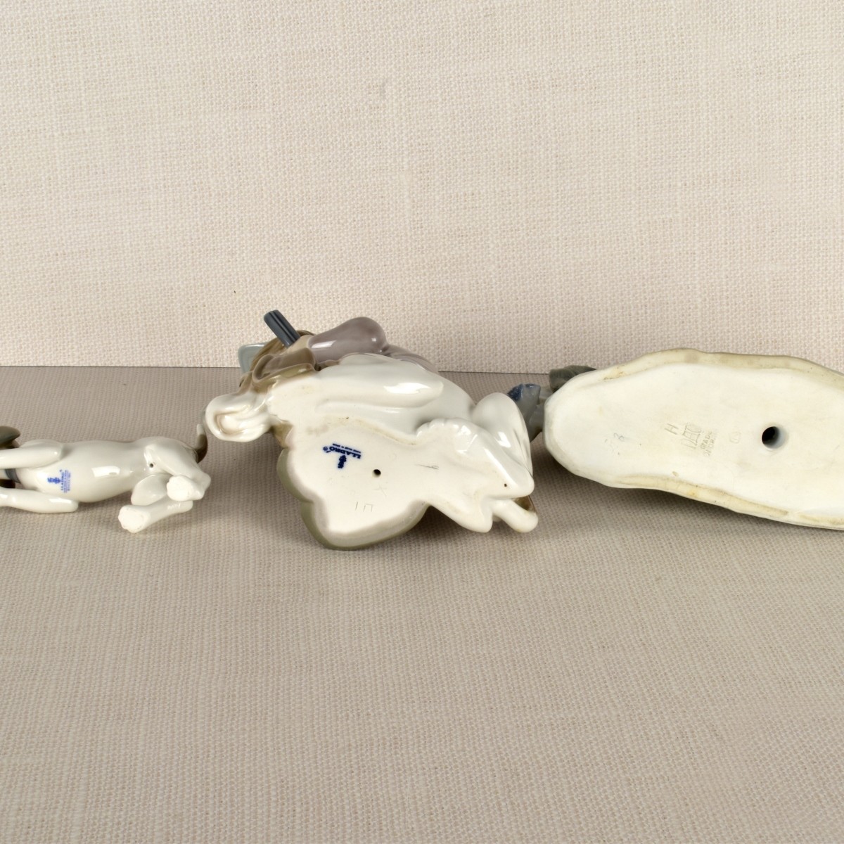Three lladro Porcelain Hunt Dog Figurines
