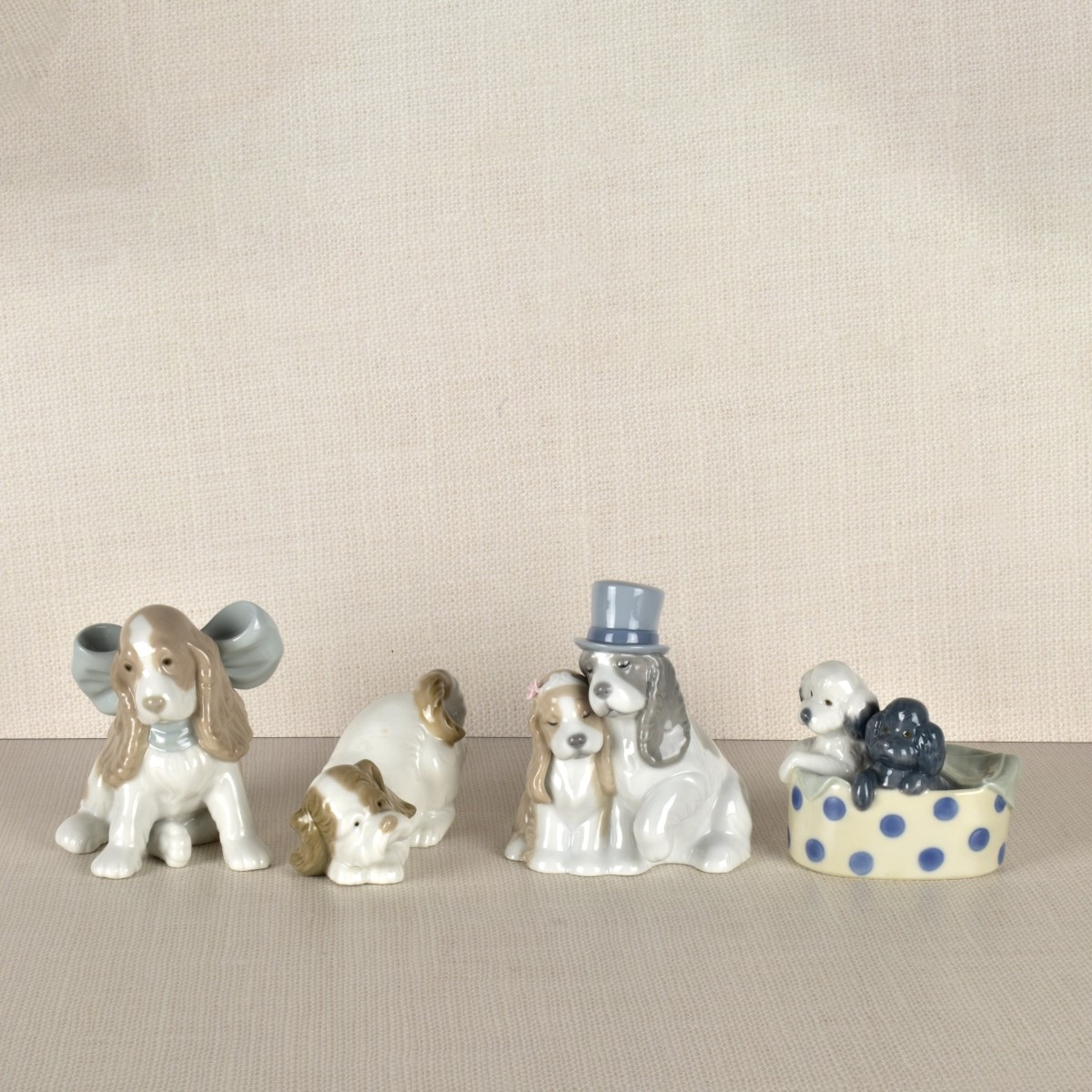 Four Nao Porcelain Dog Figurines