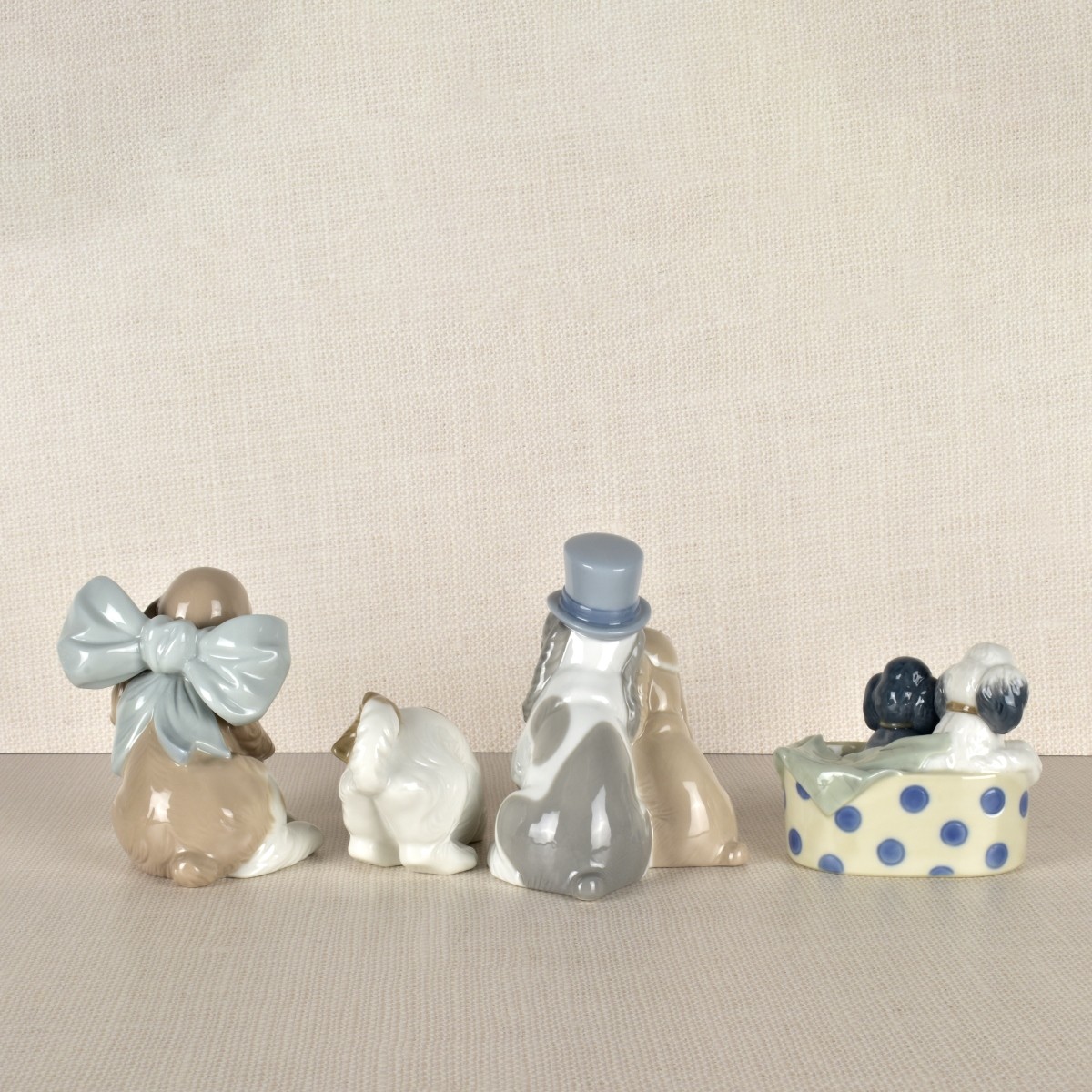Four Nao Porcelain Dog Figurines