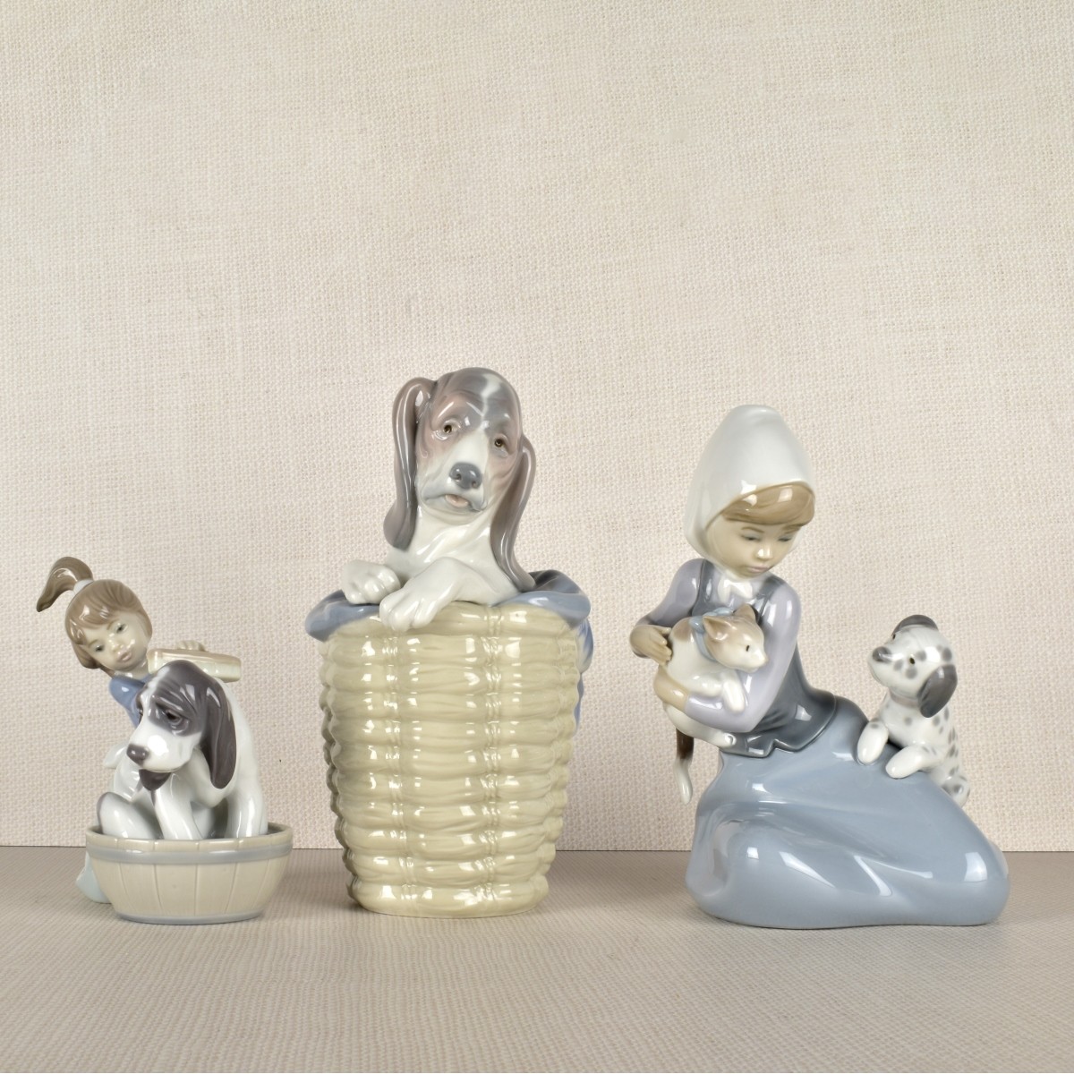 Three Lladro Porcelain Dog Figurines
