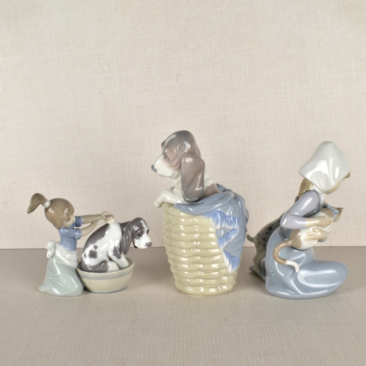Three Lladro Porcelain Dog Figurines