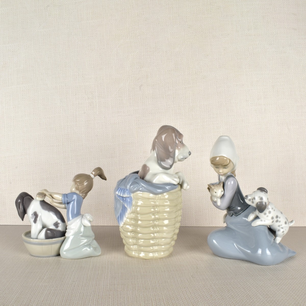 Three Lladro Porcelain Dog Figurines
