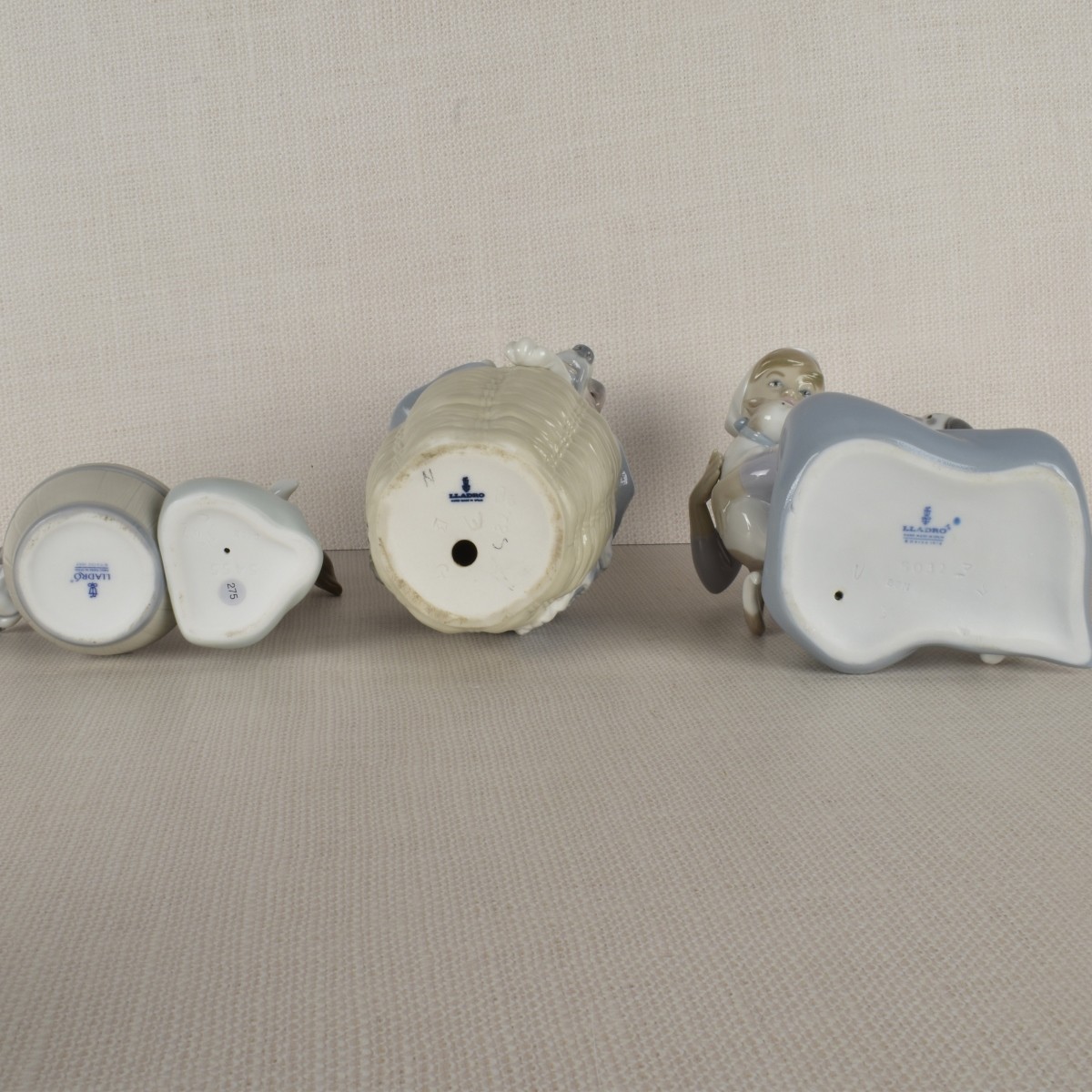 Three Lladro Porcelain Dog Figurines