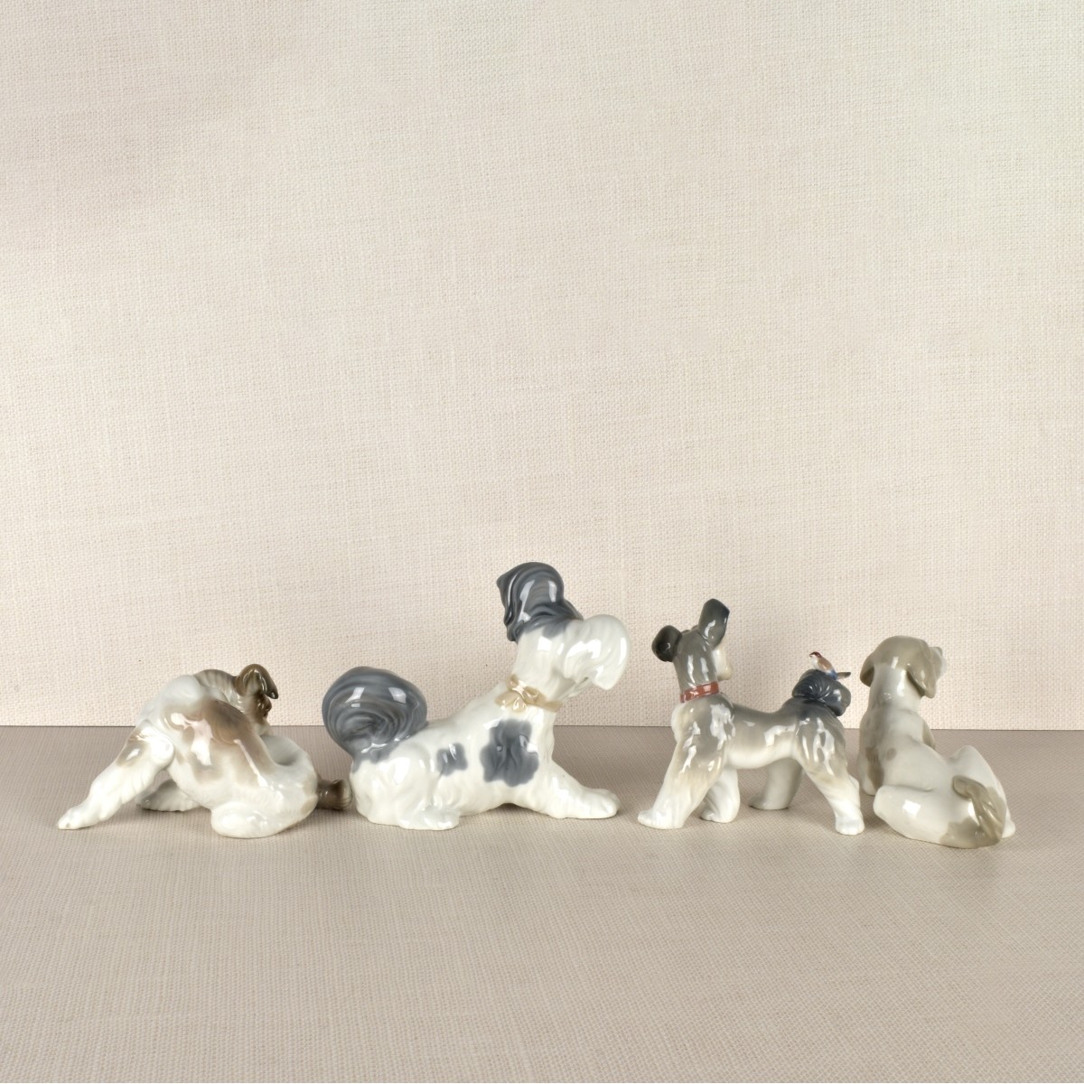 Four Lladro Porcelain Dog Figurines