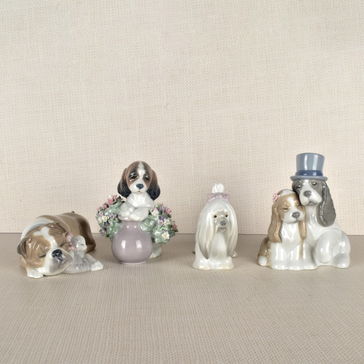 Four Lladro Porcelain Dog Figurines
