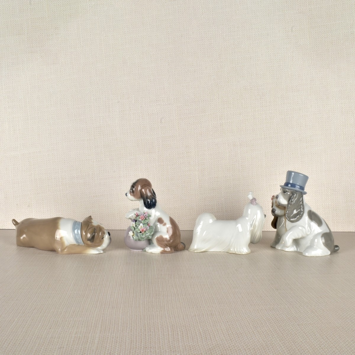 Four Lladro Porcelain Dog Figurines
