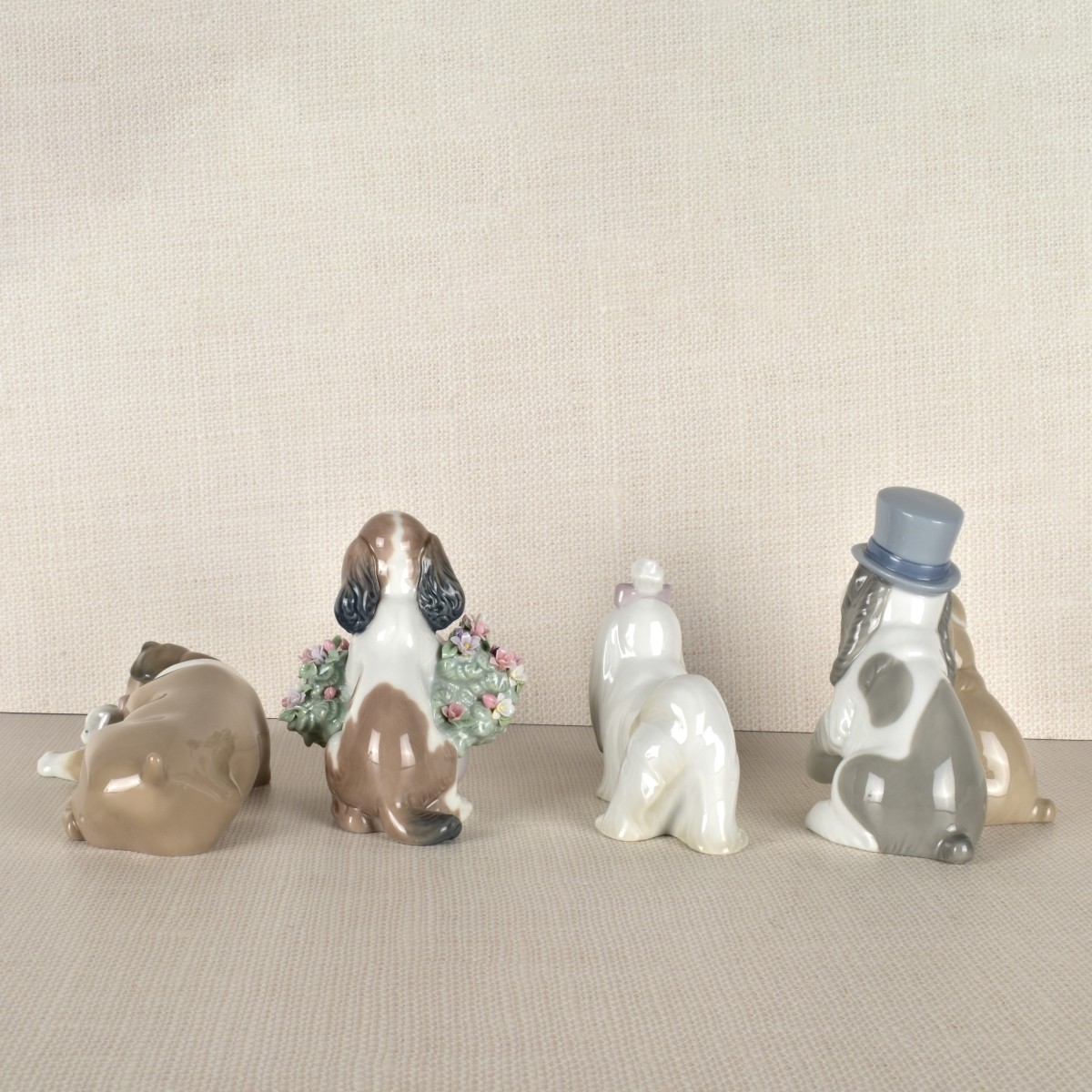 Four Lladro Porcelain Dog Figurines