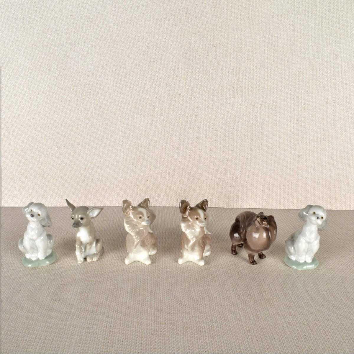 Six Porcelain Dog Figurines mostly Lladro
