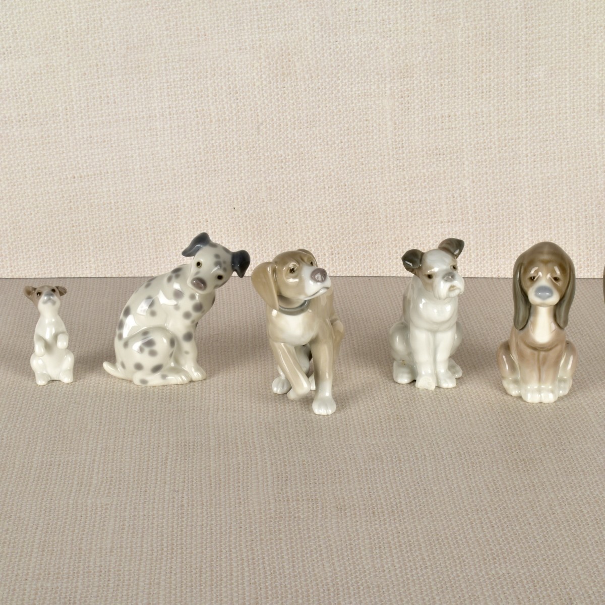 Five Lladro Porcelain Dog Figurines