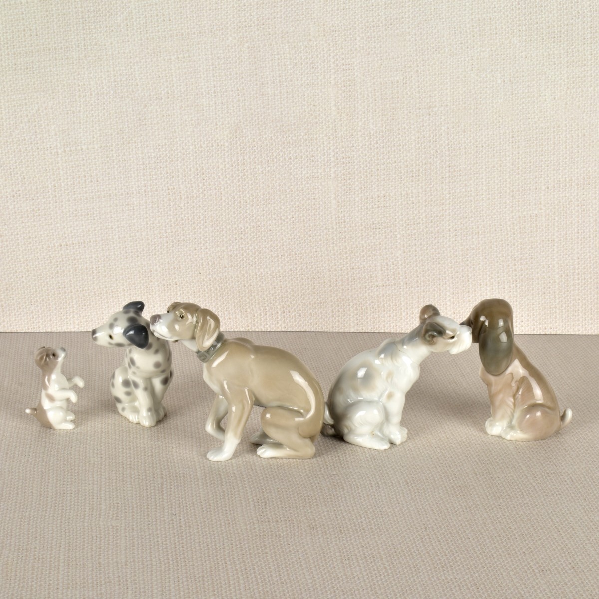 Five Lladro Porcelain Dog Figurines