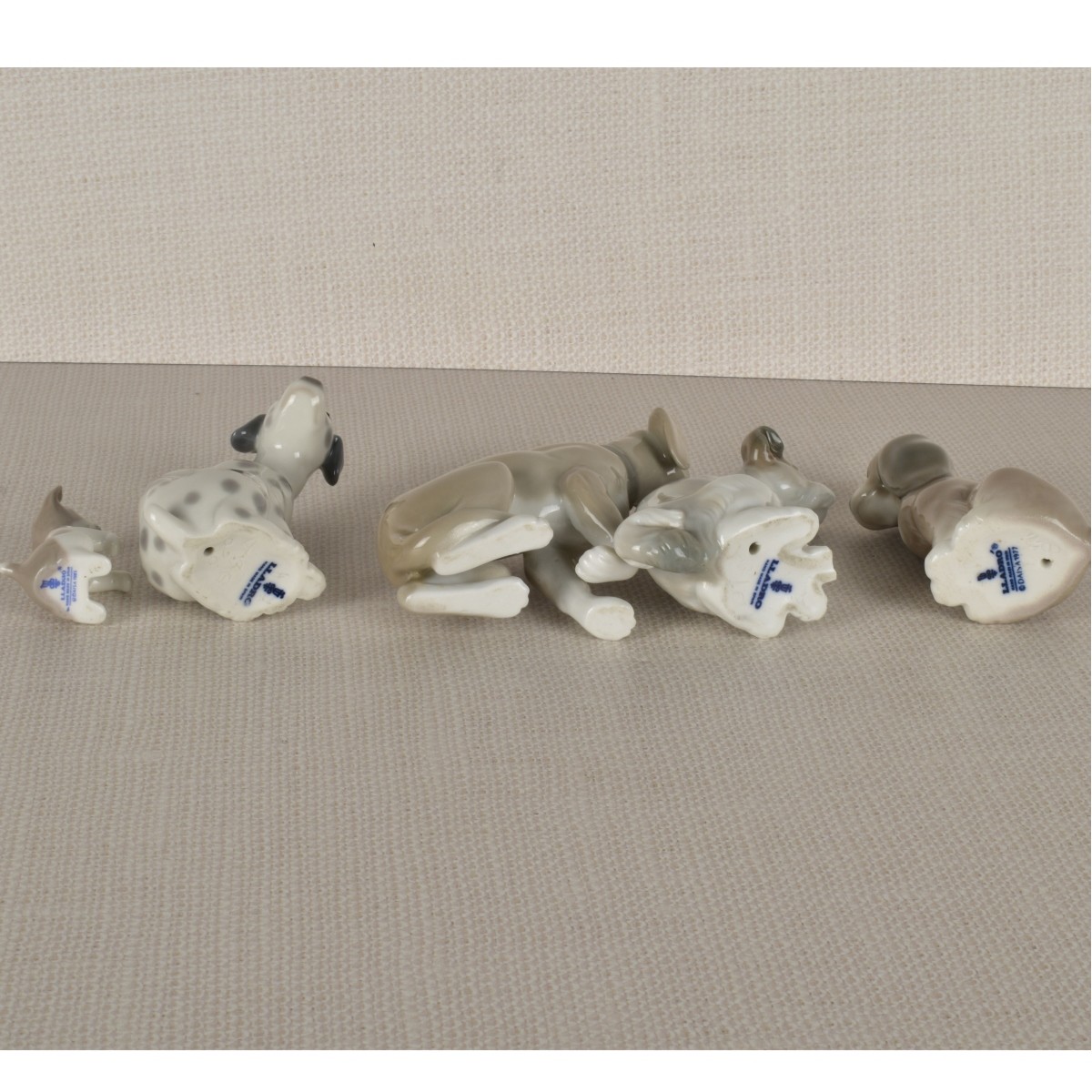 Five Lladro Porcelain Dog Figurines