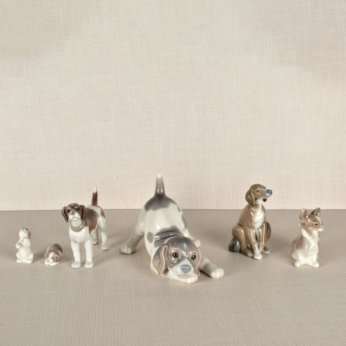 Six Lladro Porcelain Dog Figurines