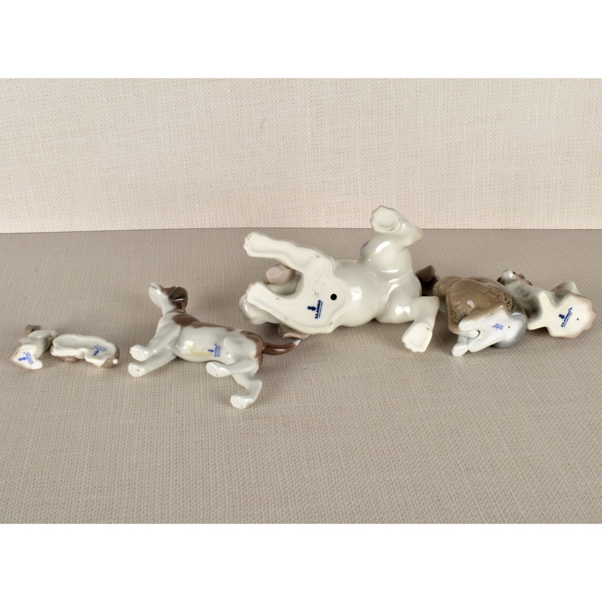 Six Lladro Porcelain Dog Figurines