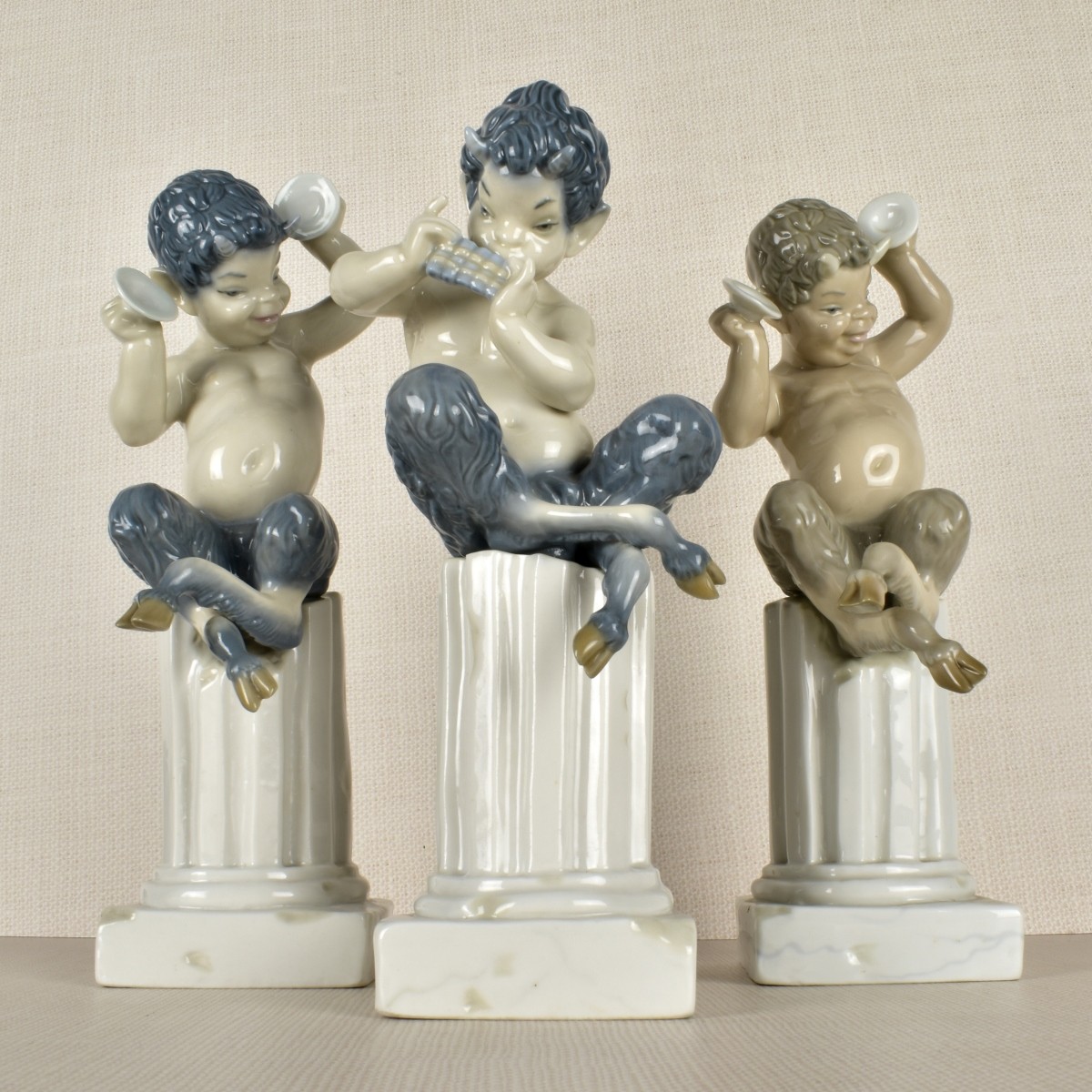 Three Lladro Satyr / Pan Porcelain Figurines